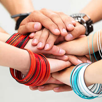 Teens joining hands